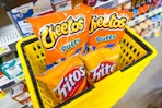 cheetos and fritos in yellow shopping basket