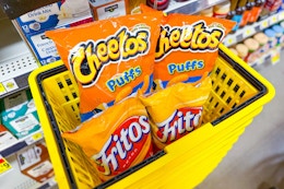 cheetos and fritos in yellow shopping basket