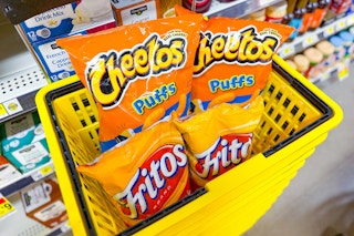 cheetos and fritos in yellow shopping basket