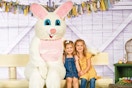 two kids posing for a photo with the easter bunny at cabela's