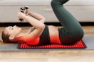 woman excersising on floor with mat