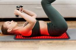 woman excersising on floor with mat