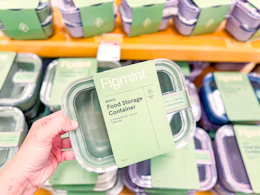 hand holding figmint food storage container in target aisle