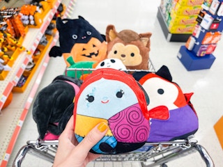 hand holding halloween squishmallows
