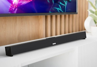 soundbar sitting on white entertainment center