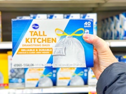 hand holding a box of kroger trash bags