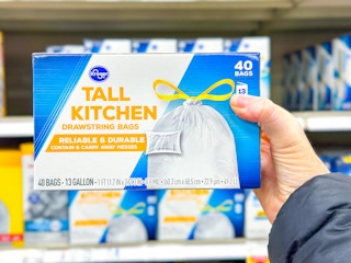 hand holding a box of kroger trash bags