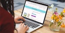 person on macbook shopping easter sale items on zulily site