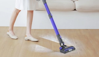 person using eicobot cordless stick vacuum