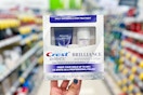 hand holding crest brilliance whitening 2-step kit