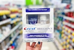 hand holding crest brilliance whitening 2-step kit