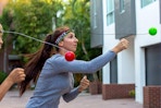 family playing a reflex ball game