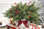 Artgar 6 Pcs Christmas Pine Branches on a dining room table.