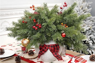 Artgar 6 Pcs Christmas Pine Branches on a dining room table.