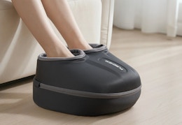person using the foot massager
