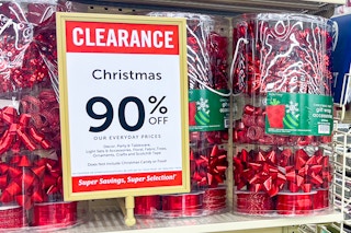 containers of holiday bows and gift wrap on hobby lobby end cap during 90% off holiday clearance