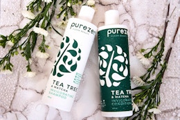 Lifestyle Purezero haircare with a marble background