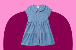 toddler denim dress on a pink background