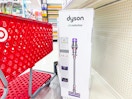 target cart parked in front of dyson vacuum