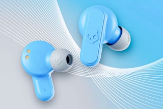 Stock image of Skullcandy Dime XT 2 True Ear Buds with abstract backgorund