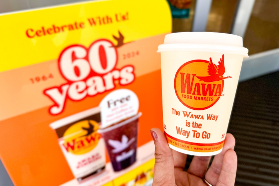a sign at the wawa self serve coffee station advertising free hot coffee on Wawa Day