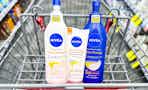 three nivea skin firming lotions in a shopping cart