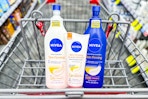 three nivea skin firming lotions in a shopping cart