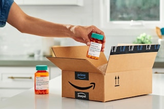 Amazon box and branded prescription bottles from amazon