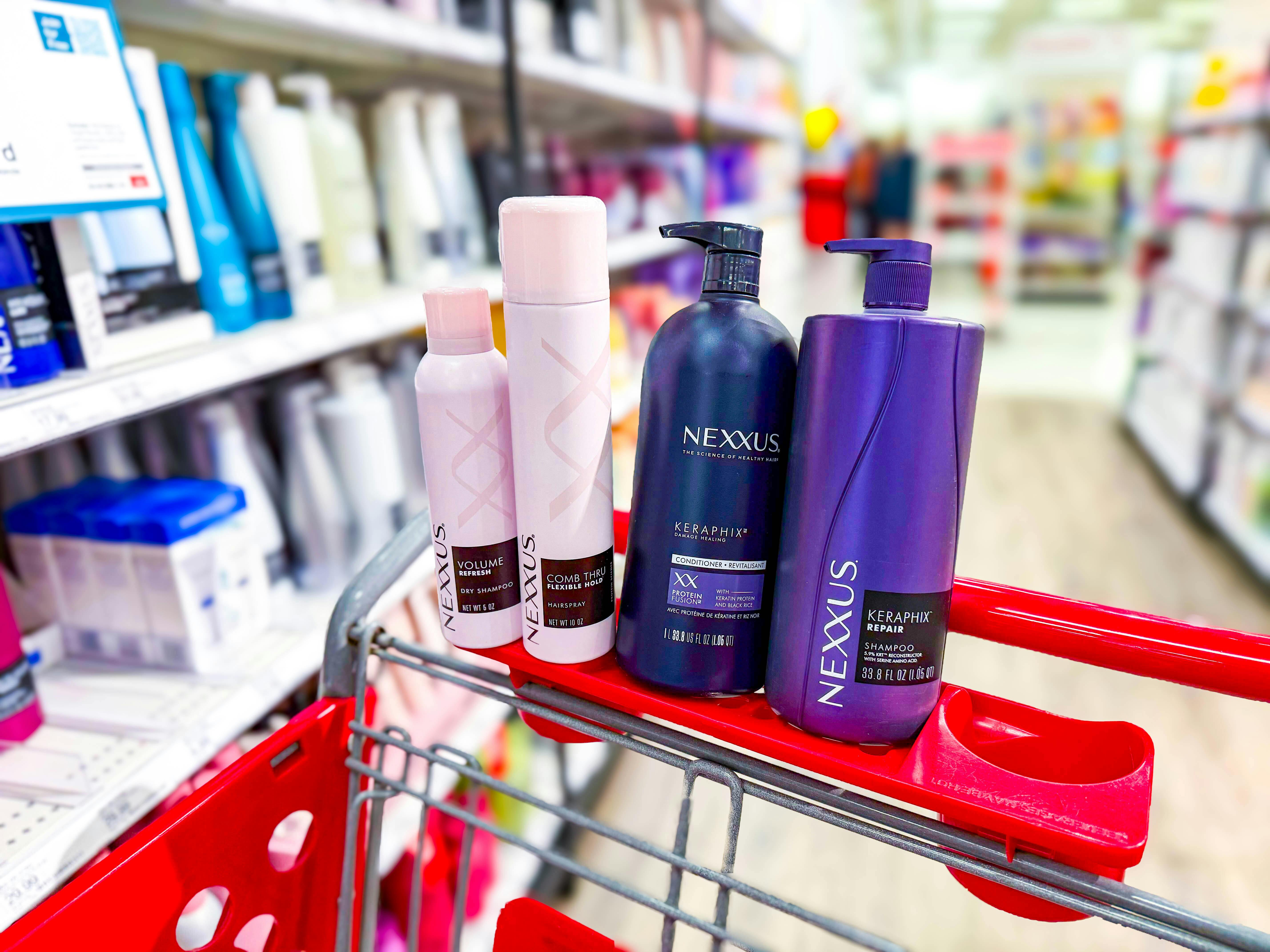 nexxus hair care items sitting on top a target cart