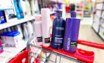 nexxus hair care items sitting on top a target cart