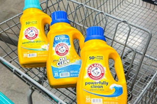 three arm and hammer laundry detergents in a shopping cart