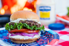 a hamburger on a plate on a table