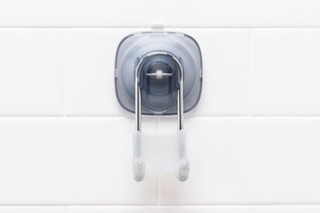 OXO Good Grips Suction Shower Hook on a shower tile wall.