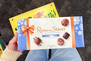 hand holding chocolate gift boxes