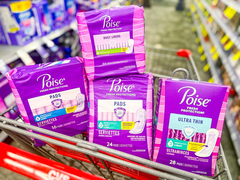 4 packs of poise pads in a cart
