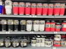 A shelf at Dick's sporting goods stocked with Yeti brand beverage containers, including Rambler 20oz tumblers, Rambler 14oz mugs, and ...