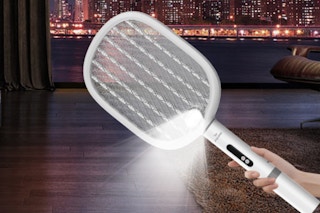 hand holding a electric fly swatter with light