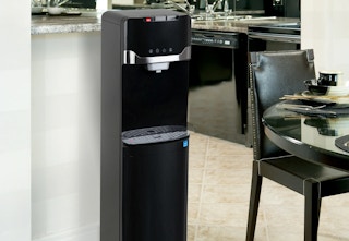 black bottom loading water dispenser in a kitchen
