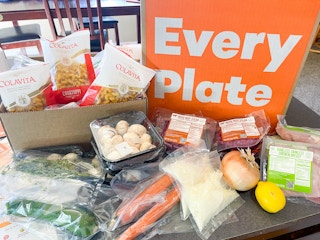 food on kitchen counter in front of every plate box