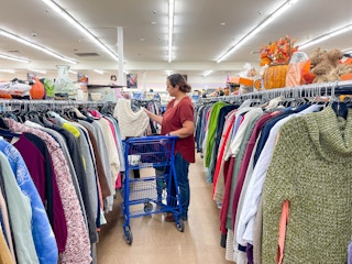 a woman shopping in the woman clothing aisles