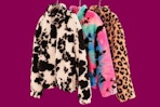 3 prints of the Justice Kids' Sherpa Pullovers (all hanging on clothes hangers)