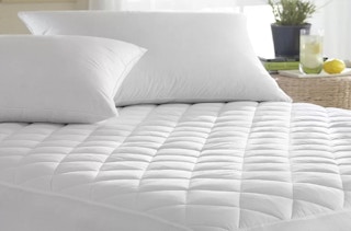 a mattress pad on a bed