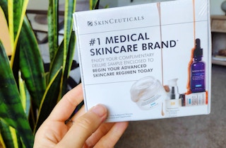 A person holding a skinceuticals sample.