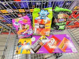 a variety of halloween candy in a cart