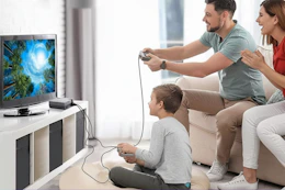 a family playing on a retro gaming system