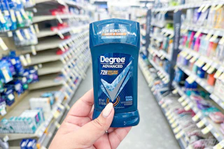 hand holding degree deodorant in a store aisle