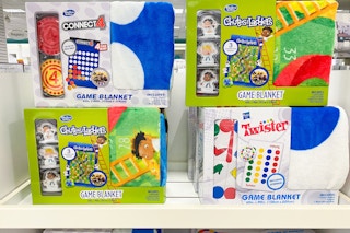 a display of hasbro game blankets on a shelf