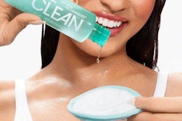 a woman using real techniques eye makeup remover