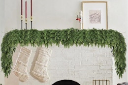 a christmas garland over a fireplace