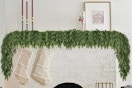 a christmas garland over a fireplace